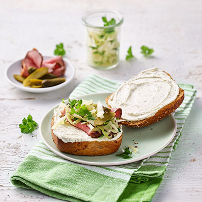 Rye roll with Philadelphia Herbs, roast beef, coleslaw and cornichon